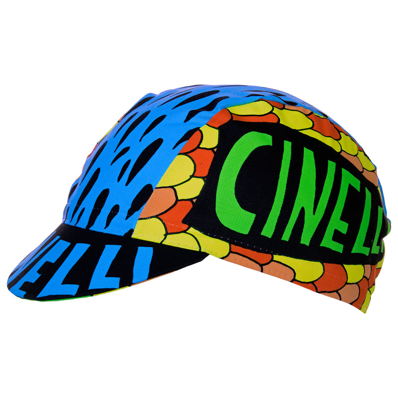 Side view of the Cinelli Ana Benaroya Poseidon Cotton Cycling Cap.  Cinelli is printed on the top of the peak as well as each side.